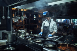 Shot of a chef cooking in a professional kitchen